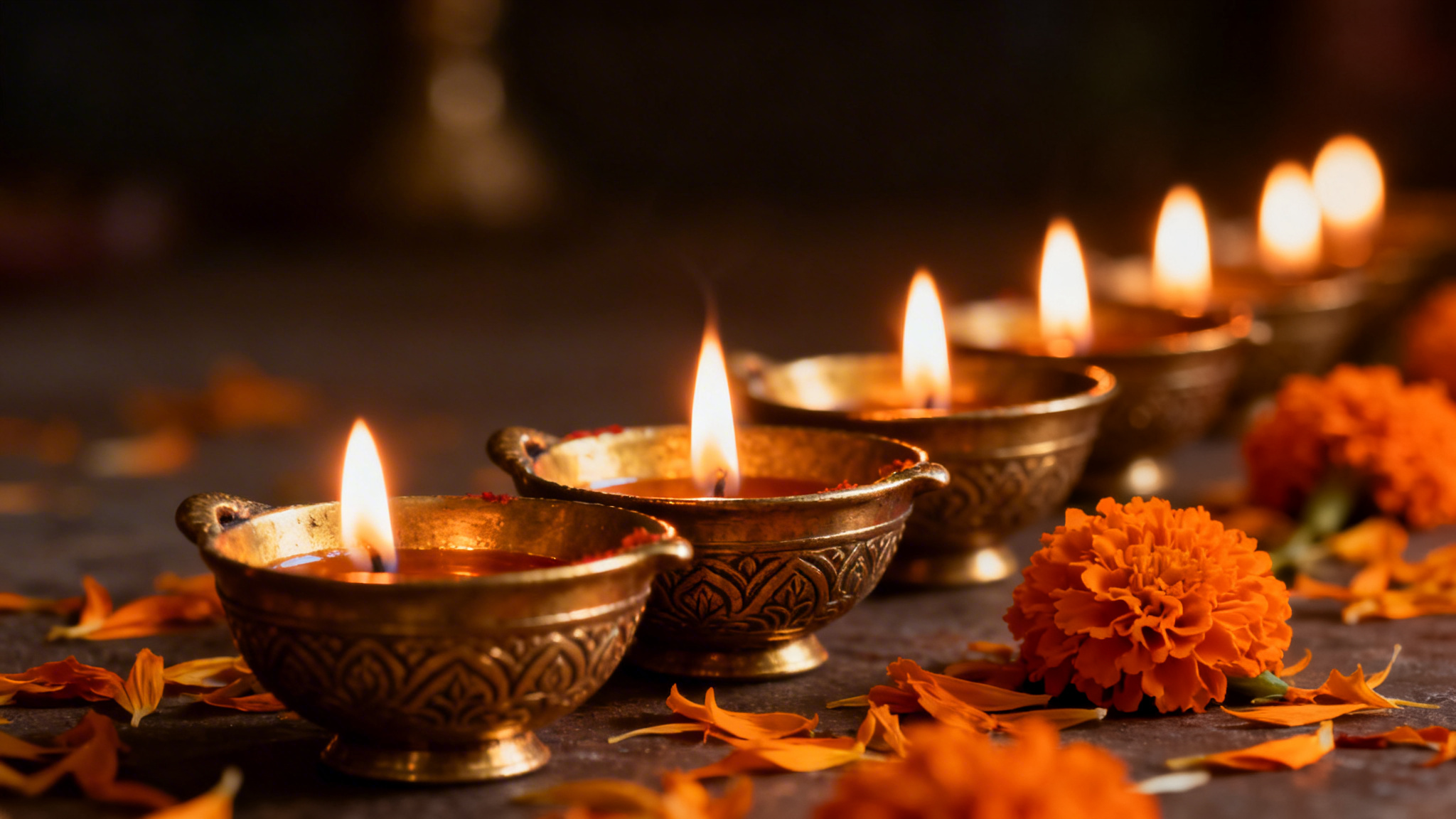 Brass diya oil lamps burning peacefully representing compassionate Asian funeral care in Handsworth and north Birmingham